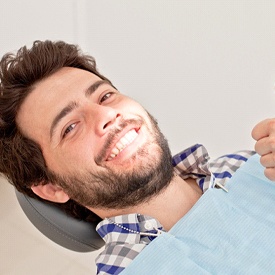 man smiling with sedation dentistry in Vienna